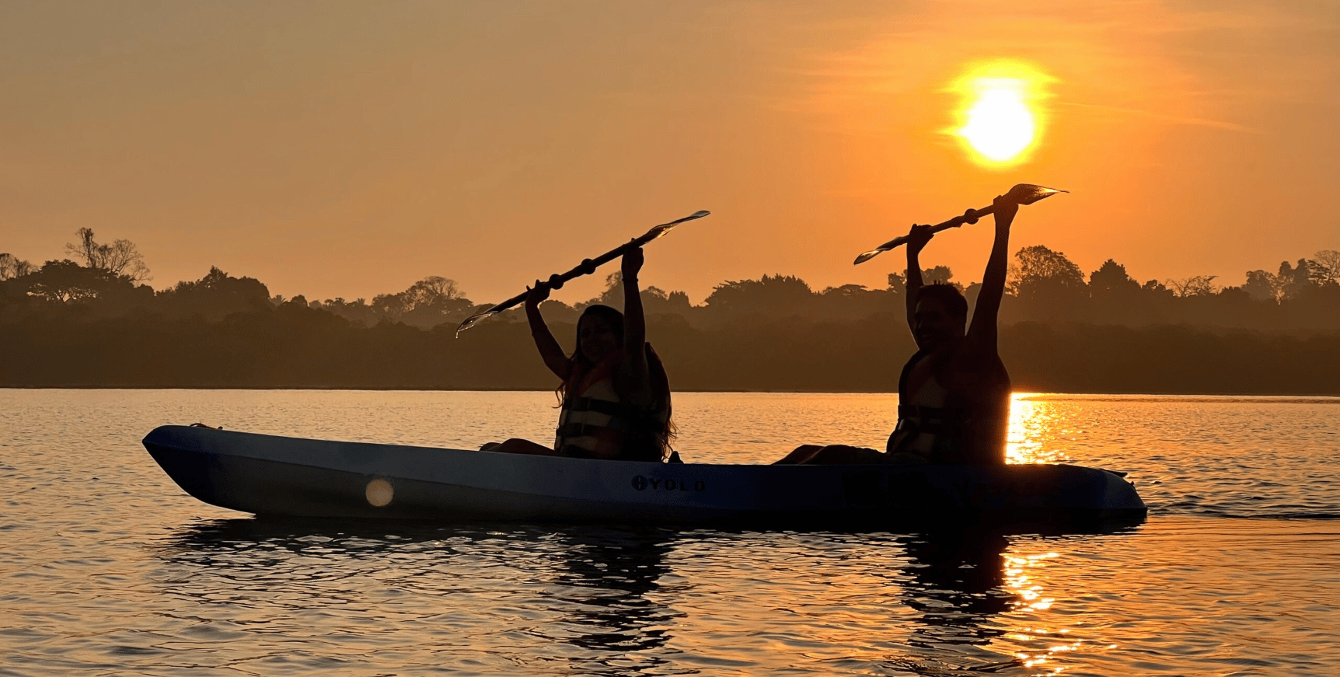 Sunset kayaking in Havelock with silhouette of paddlers