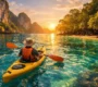 Kayaking through crystal clear turquoise waters near tropical islands in the Andaman Sea