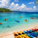 Colorful kayaks on pristine white sand beach with turquoise water in Havelock Island Andaman