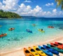 Colorful kayaks on pristine white sand beach with turquoise water in Havelock Island Andaman